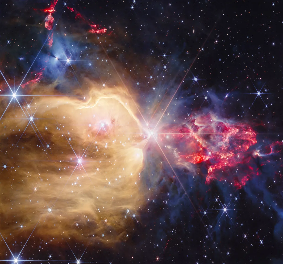 Imagem do telescópio Webb mostrando estrelas e jatos na nebulosa NGC 7129